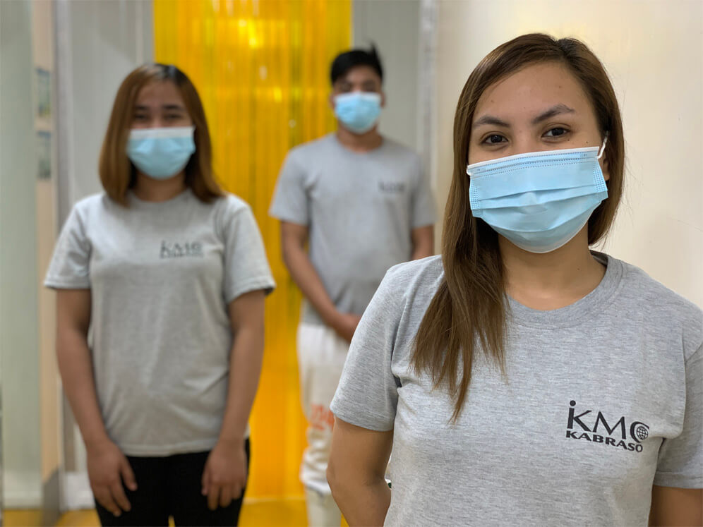 KMC employees wearing mask inside a factory