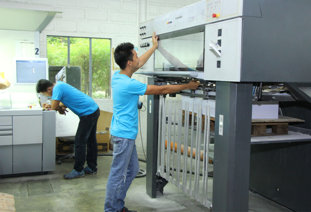 KMC employeee using industrial machines