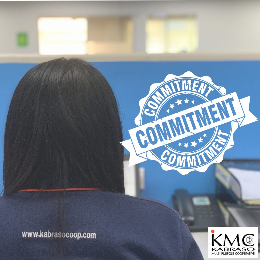 back of a femail employee wearing KMC uniform-Seal of commitment
