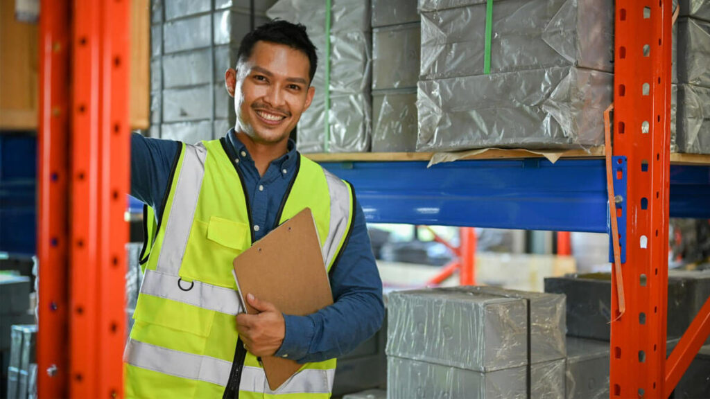 male warehouse worker uniform holding clipboard paper warehouse