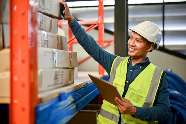 warehouse worker checking inventory with clipboard in hand