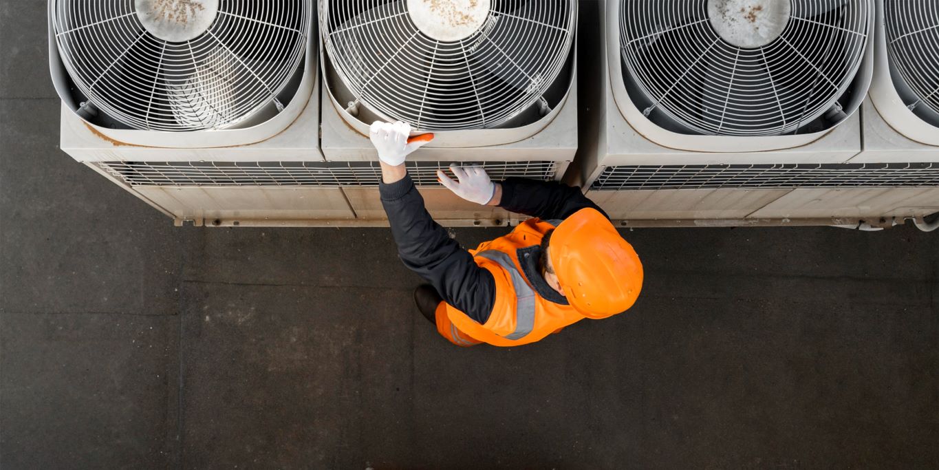 A manpower of service contracting company that provides workforce in the Facility Management Industry is wearing safety gears while inspecting equipment