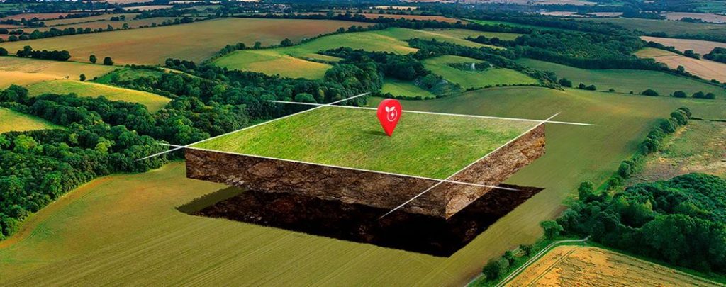 huge piece of green grass land located with red pin for renewable energy projects